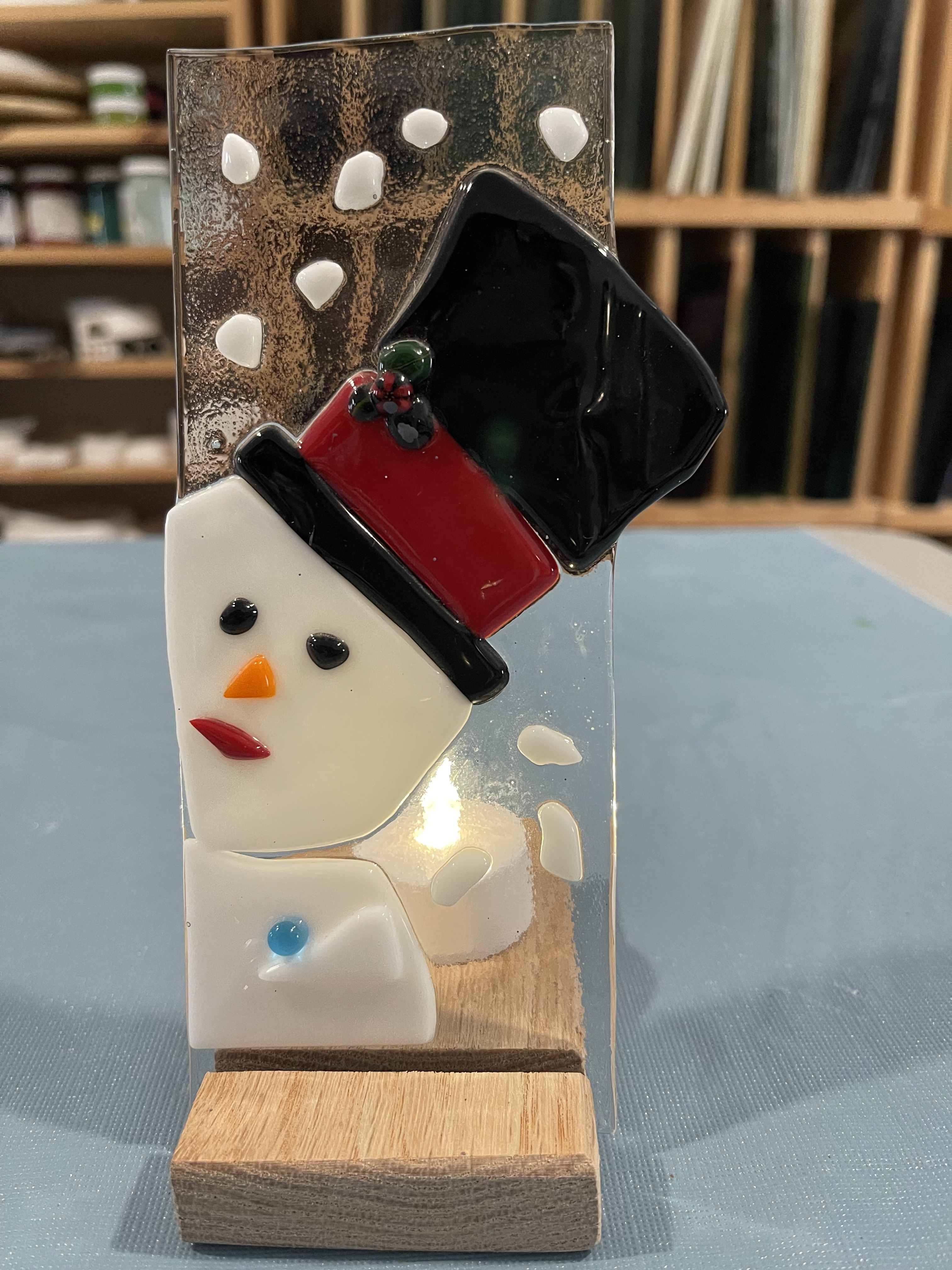 Picture of a fused glass snowman with candle