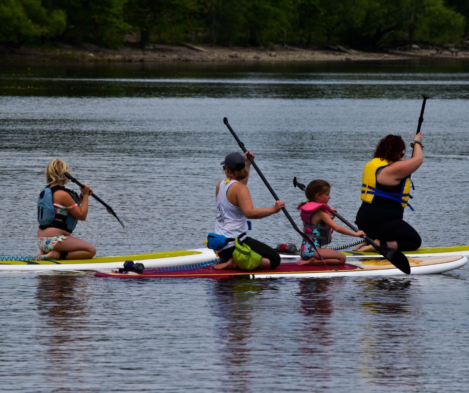 A family paddling on paddleboards.