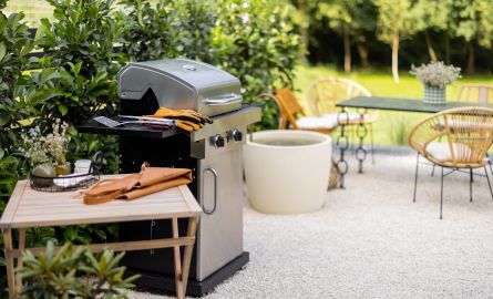 A barbecue on a backyard patio.