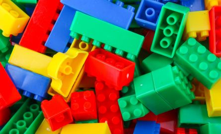 A collection of colourful toy building blocks.