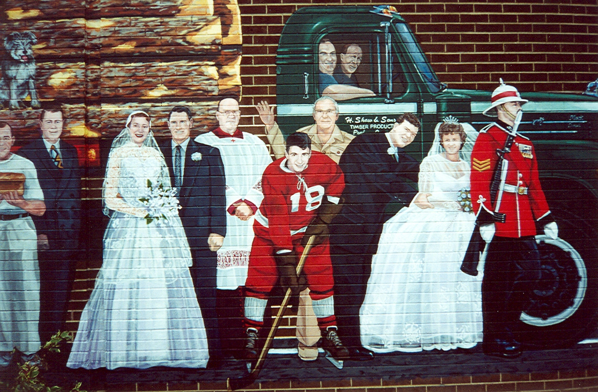 Marching Toward the Millennium Mural, features several people standing in front of a logging truck.