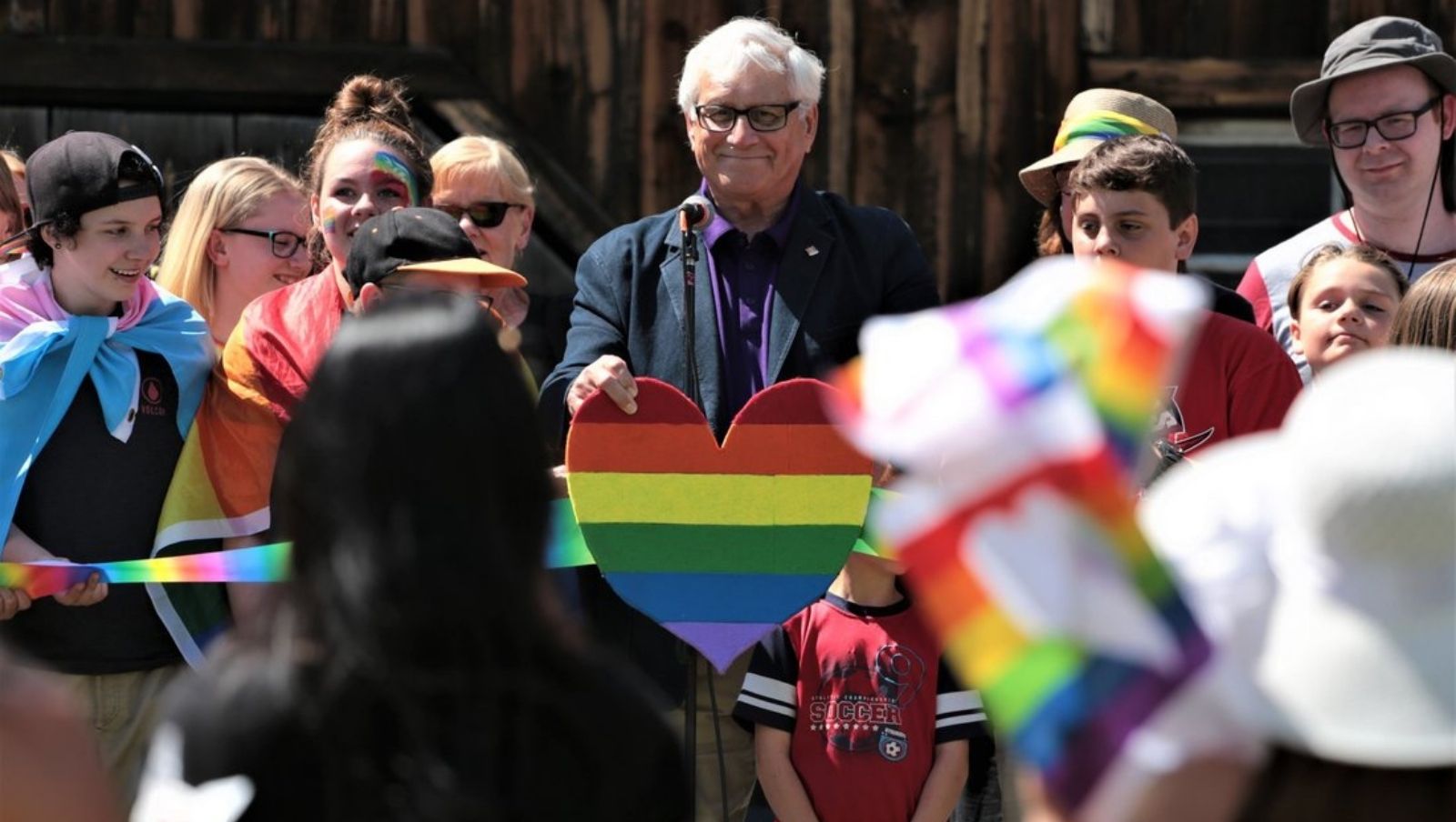 Mayor LeMay during pride week holding a rainbow heart.
