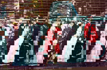 Marching Toward the Millennium Mural, features several people standing in front of a logging truck.