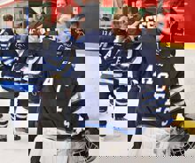 Terry O'Neill Regional Silver Stick Hockey Tournament A young hockey player celebrates after a victory.